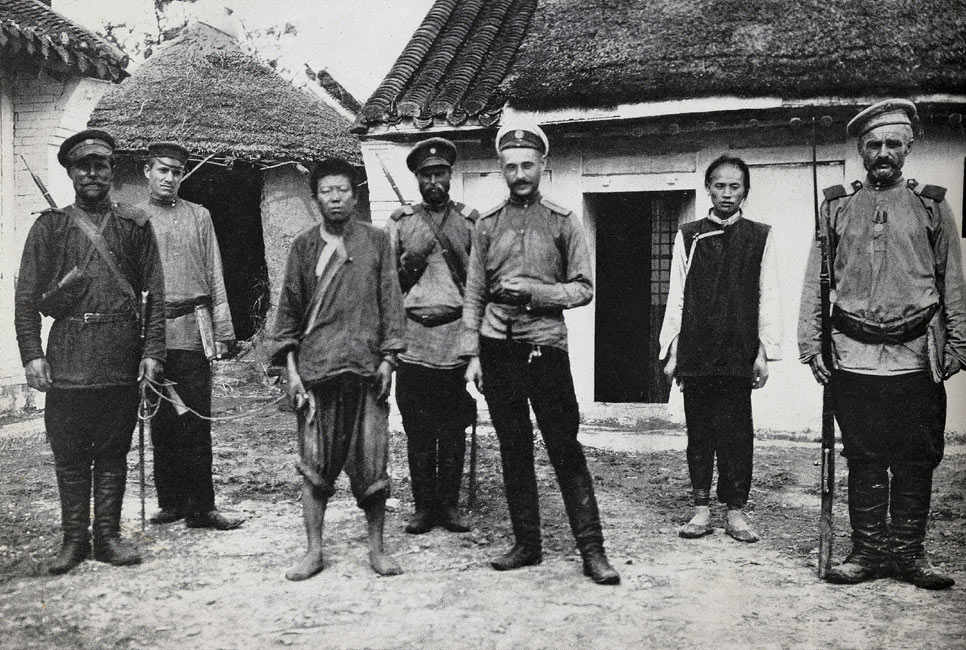 A Disheartened Japanese Spy and his Quizzical Russian Captors  page 156, A Photographic Record of the Russo-Japanese War, Edited by James H. Hare 1905, PF Collier & Son, New York