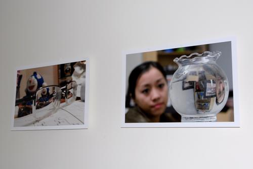 Two photographs displayed on a white wall.