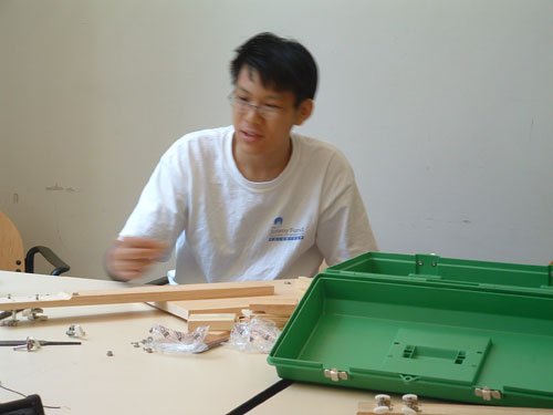 Student working on his guitar.