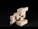 Photograph of bass wood cube model with shifted portions of the cube.