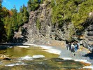 A scenic river and steep cliffs.