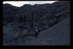 Students and teachers puzzling over an outcrop.