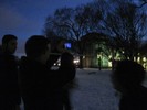 Photo of a student pointing his phone toward the object to identify it.