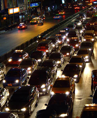 Photo of many cars at night stuck on a highway in Bangkok.