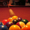 billiard balls being struck by a cue ball