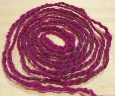 Photo of three coils of yarn.