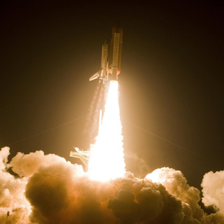 Photograph of a rocket lifting off.