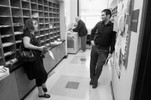 Photograph of Ms. Freeman in the school’s library for a faculty senate meeting at the end of the school day at 2:15 p.m.