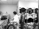 Photograph of the people at the Lost Sock Laundromat. They act much like planets, orbiting around each other but never meeting.