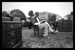 Photograph of a vendor resting.