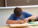 Student working on their guitar.