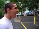 A trick photo makes it appears as if a student is about to eat a large truck.