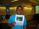 A student holds up a completed project.